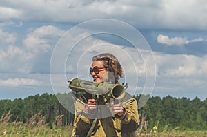 Girl in uniform with a Bazooka