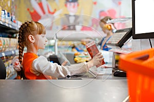 Girl in uniform at the cash register, playroom