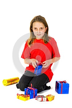 Girl is unwrapping her presents