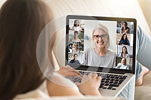 Girl use laptop involved at group videocall with diverse women