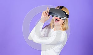 Girl use modern technology vr headset play shooter game. Lady with gun gesture. Enthralling interaction virtual reality