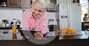 Girl Use Tablet Computer Laughing, Young Woman In Kitchen Chatting Online Studio Modern House Interior