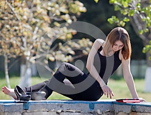 Girl uses touchpad on open air photo
