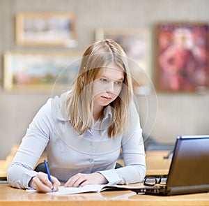 Girl using computer in a library