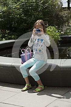 Girl using a digital camera