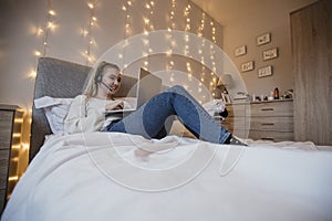 Girl Using Laptop in Bedroom