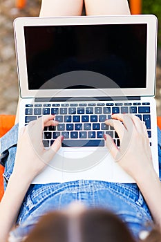 Girl using laptop, close-up