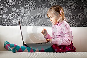 Girl using laptop computer