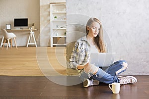 Girl using laptop in interior