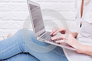 Girl using laptop side