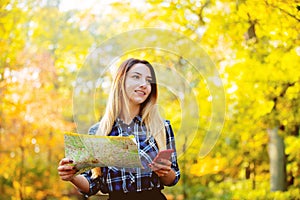 Girl using a mobile aplication and map for a navigation