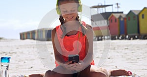 Girl using mobile phone in the beach 4k