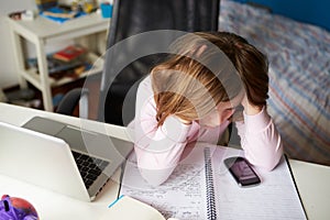 Girl Using Mobile Phone Instead Of Studying In Bedroom