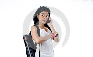 Girl using mobilephone and waiting for someone on white background