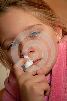 Girl using nasal spray