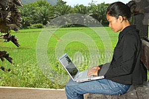 Girl Using Notebook Computer Outside