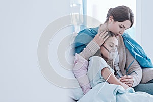 Girl using an oxygen mask