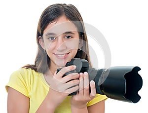 Girl using a professional camera isolated on white