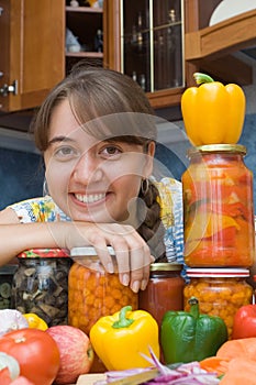 Girl with vegetables and jars photo