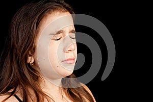 Girl with a very sad face crying