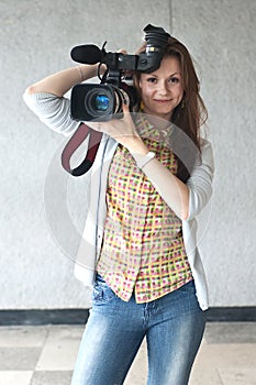 Girl with a videocamera photo