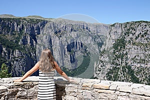 Girl on the viewpoint Vikos gorge Greece