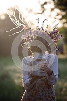 Girl in the village works in the garden