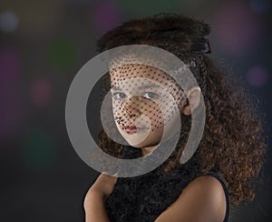 Girl in vintage fur hat on bokeh background