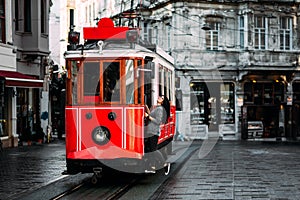 Girl in a vintage tram on the Taksim Istiklal street in Istanbul. Girl on public transport. Old Turkish tram on Istiklal street, photo