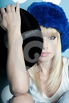 Girl with vinyl musical records in her hands