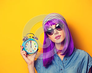 Girl with violet hair in sunglasses
