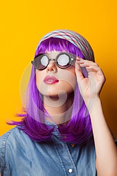 Girl with violet hair in sunglasses