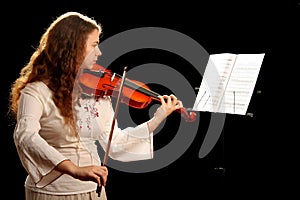 Girl violinist and pult photo