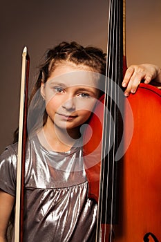 Girl with violoncello and string on gel background