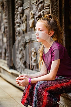 Girl visiting Shwenandaw monastery in Mandalay