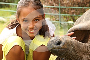 Girl visits Jonathan the giant tortoise St Helena photo