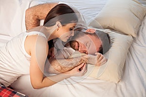 Girl wakes up in the morning after sleeping husband in bedroom 1 photo