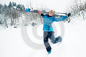 Girl walk with ski equpment in ski touring