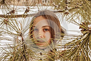 Girl walk in snowy trees. insulation in Ð¡ovid-19 . teen close up .
