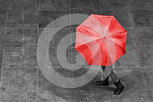 Girl walk with umbrella in rain on pavement artistic conversion