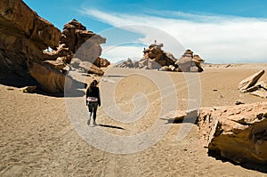 Girl walking alone in the desert