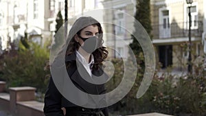 Girl walking alone outdoors during pandemic of COVID-19