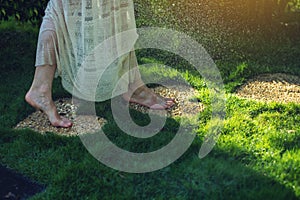 Girl walking barefoot on the stones in heart shape