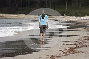 Girl walking on the beach