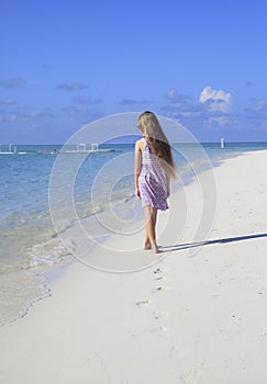 Girl walking on the beach