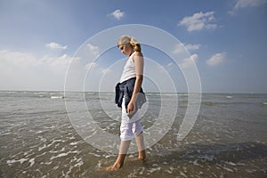 Girl walking at the beach