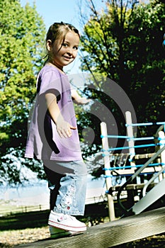 Girl Walking on a Beam