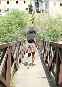 Girl walking on bridge