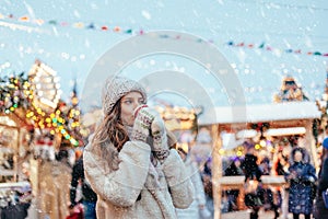 Girl walking on Christmas Market on Red Square in Moscow