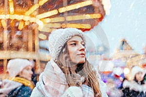 Girl walking on Christmas Market on Red Square in Moscow